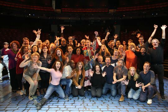 Matt Wall celebrates his Robe with fellow members of his cast. Photo by Walter McBride.