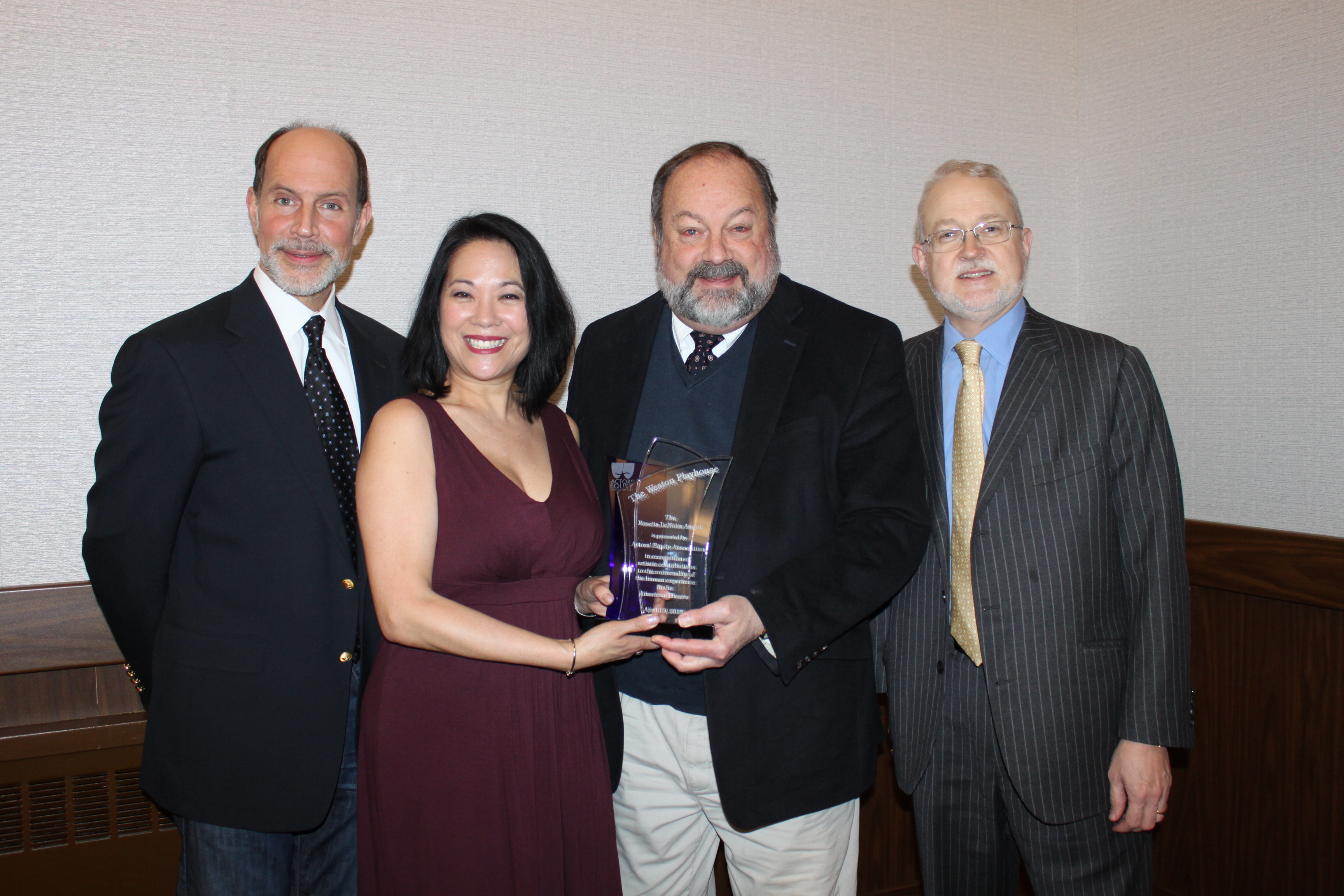 Marcus Neville, Christine Toy Johnson, Steve Stettler and Anthony Wood with the award.