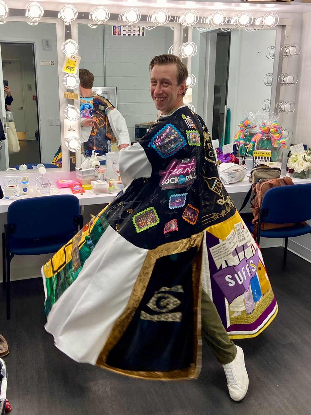 Ryan Breslin spins in the Robe in a dressing room.