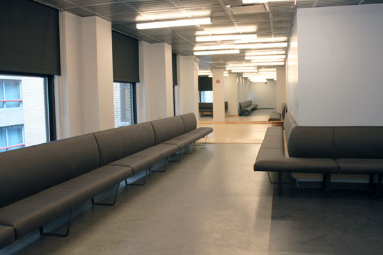The audition waiting area has ample couches along all available wall space.